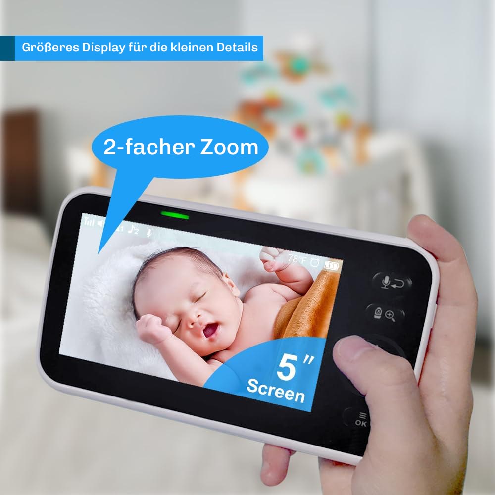 Hand haelt den Hesler-Monitor mit 5-Zoll-Bildschirm und zweifachem Zoom, auf dem ein schlafendes Baby zu sehen ist.